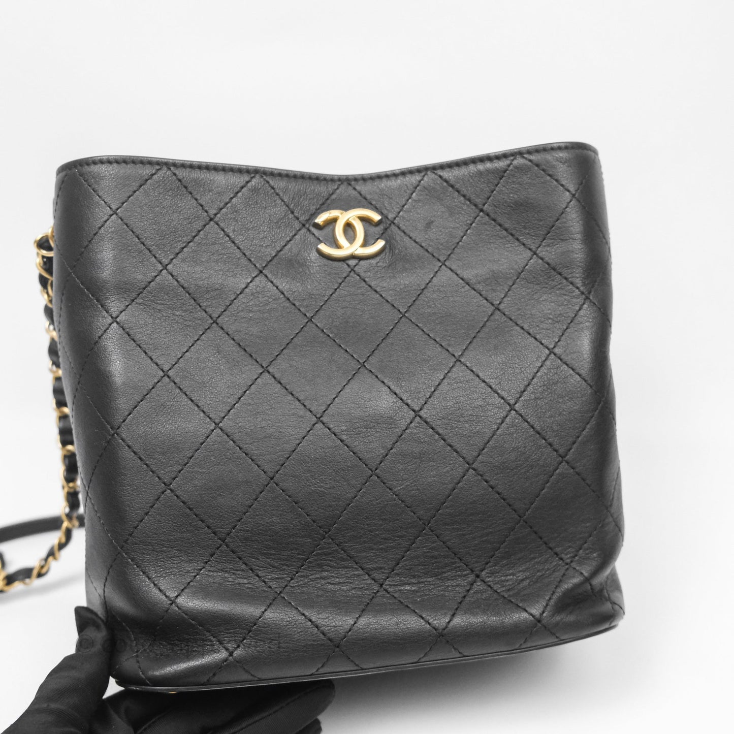 Chanel Quilted Drawstring Bucket Bag Black Calfskin Aged Gold Hardware