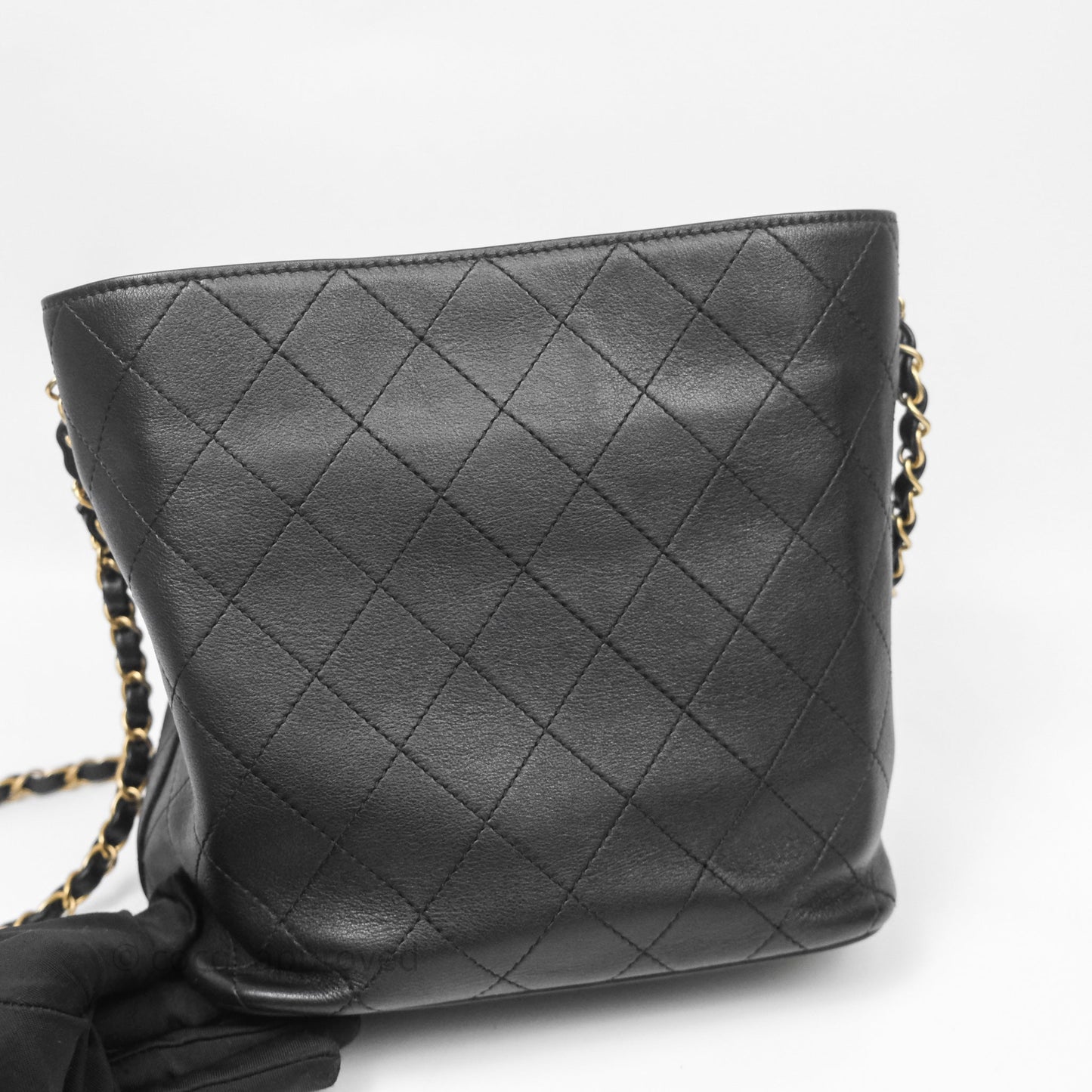Chanel Quilted Drawstring Bucket Bag Black Calfskin Aged Gold Hardware