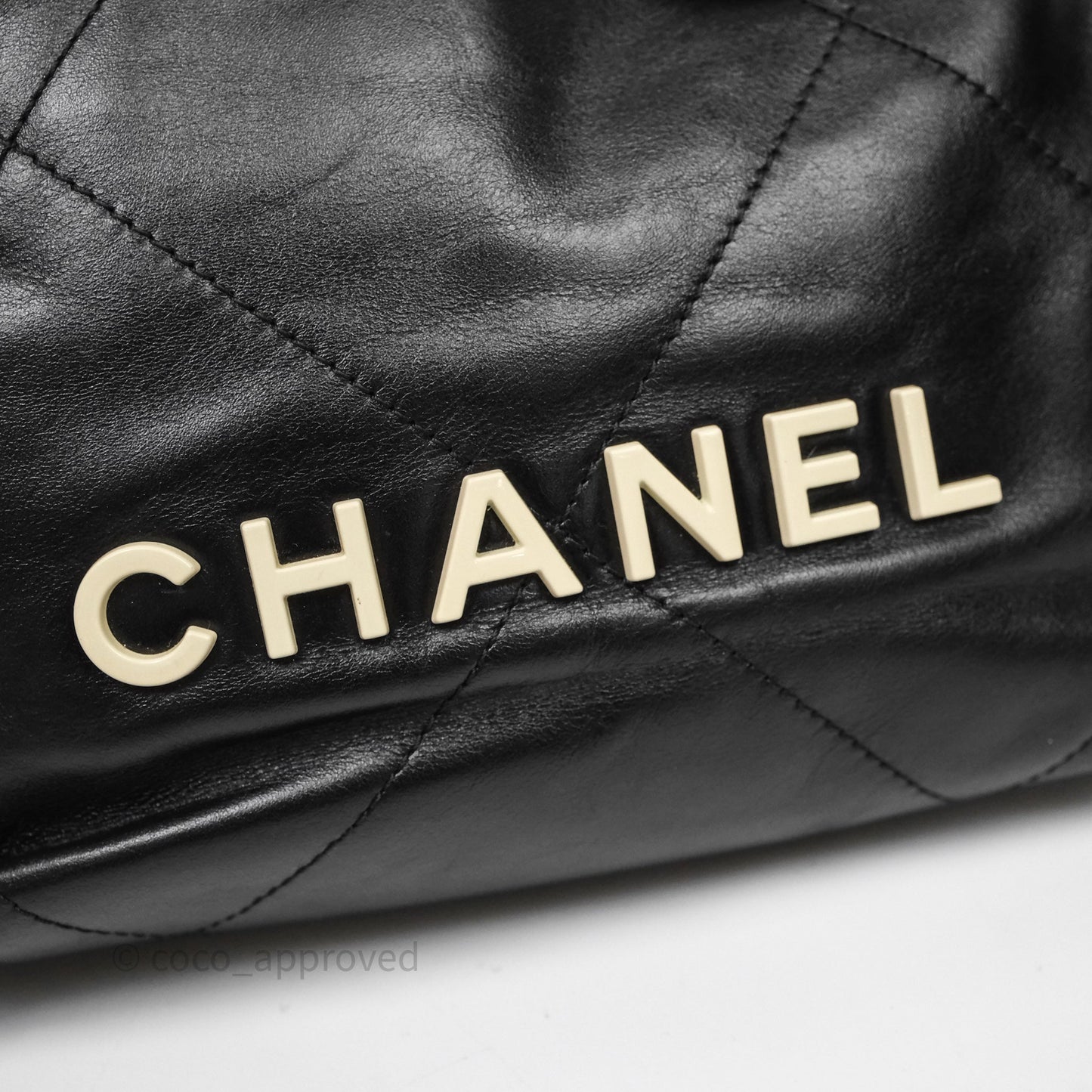 Chanel 22 Mini Bag Black Crumpled Calfskin White Lacquered Metal Logo