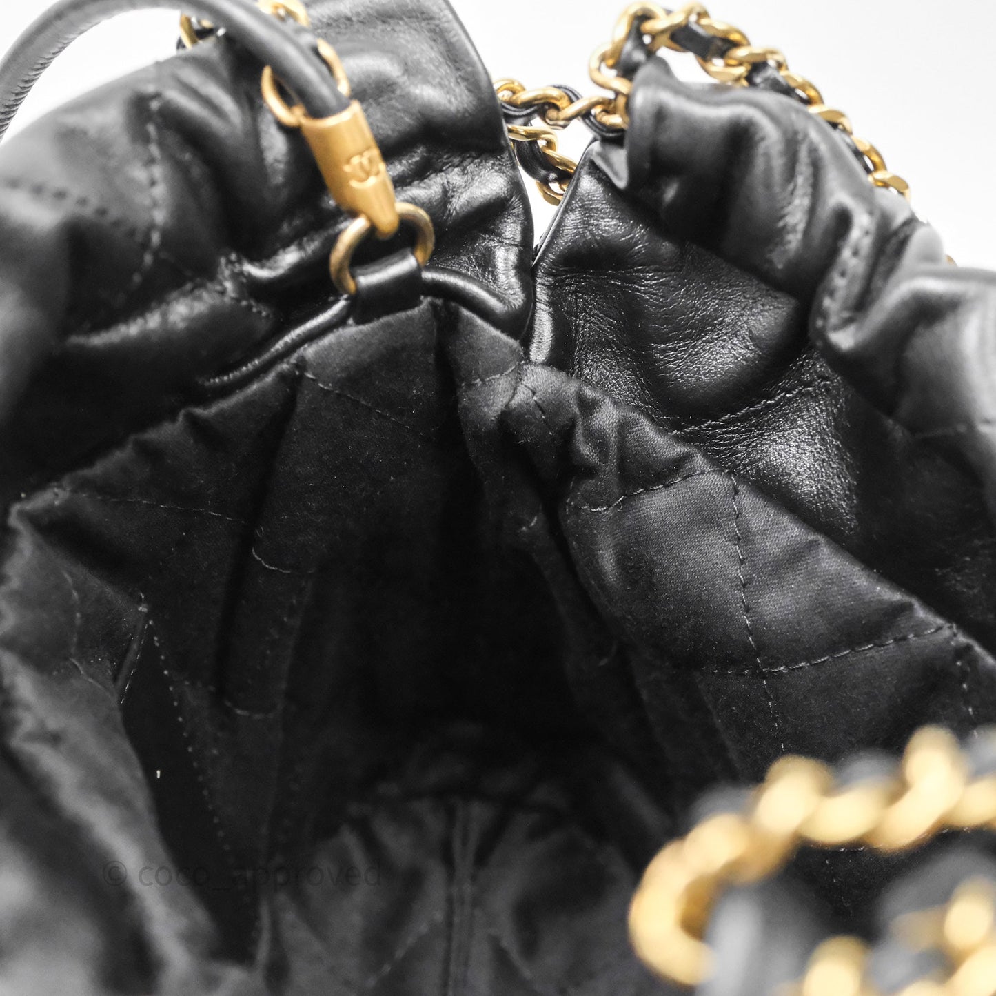 Chanel 22 Mini Bag Black Crumpled Calfskin White Lacquered Metal Logo