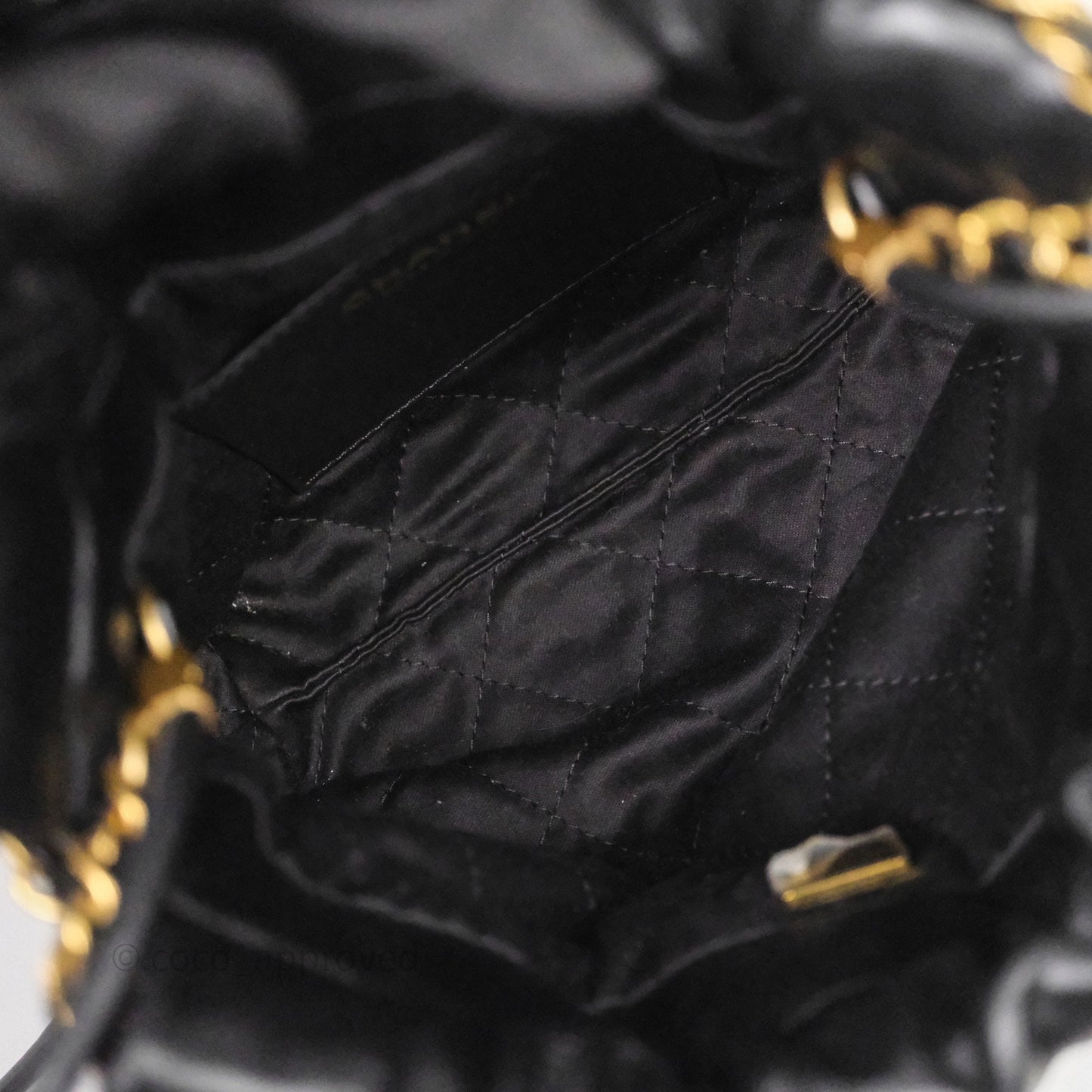 Chanel 22 Mini Bag Black Crumpled Calfskin White Lacquered Metal Logo
