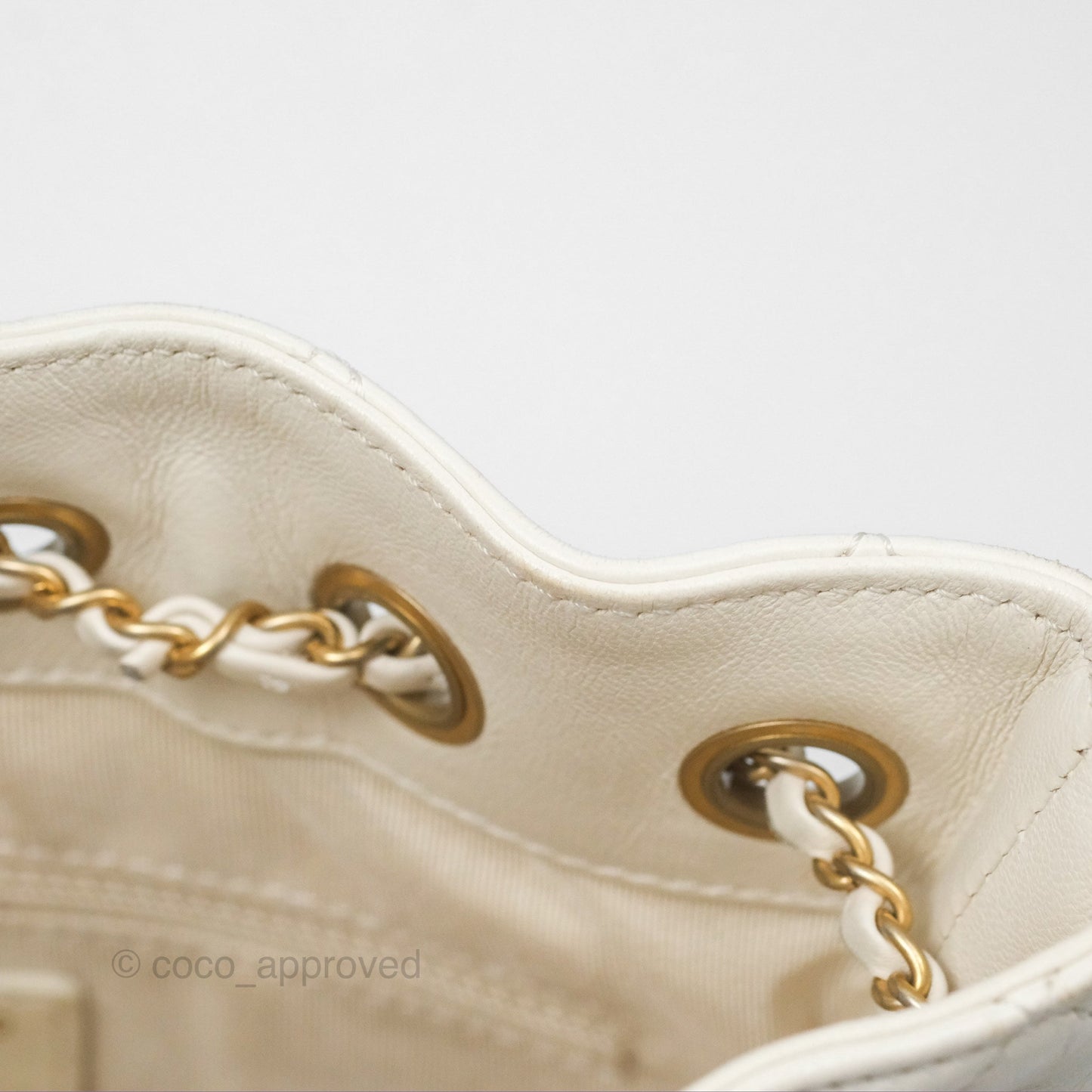 Chanel Quilted Drawstring Bucket Bag Ivory Lambskin Aged Gold Hardware