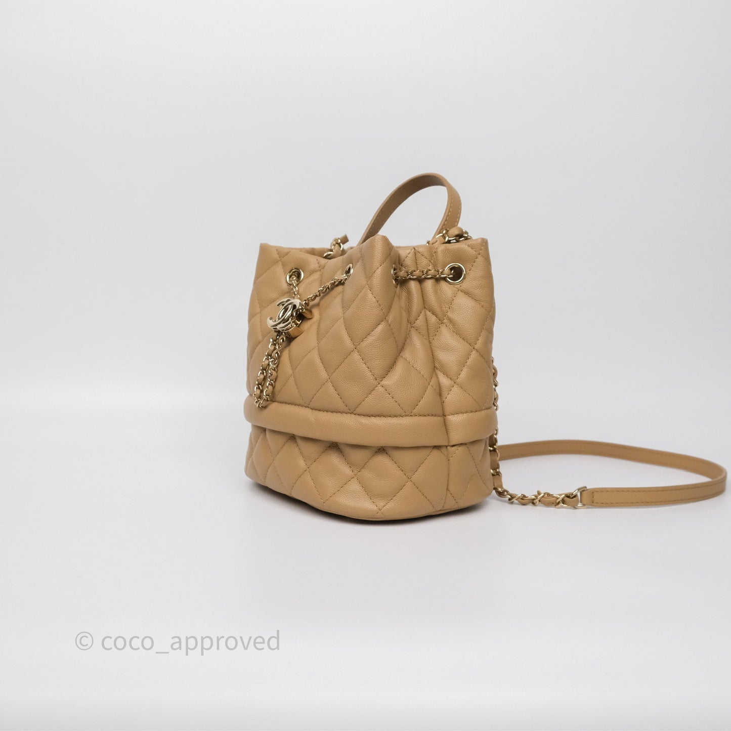 Chanel Rolled Up Bucket Drawstring Bag Beige Caviar Gold Hardware