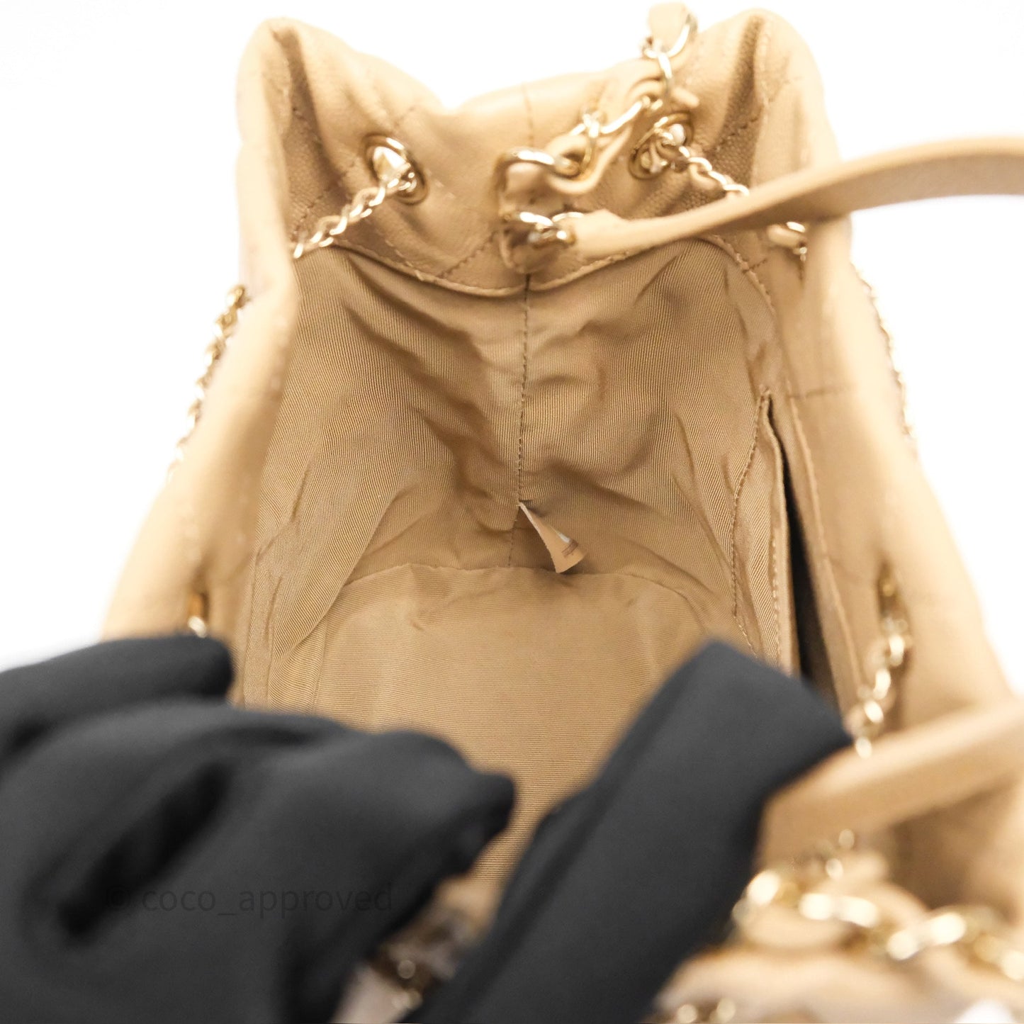 Chanel Rolled Up Bucket Drawstring Bag Beige Caviar Gold Hardware