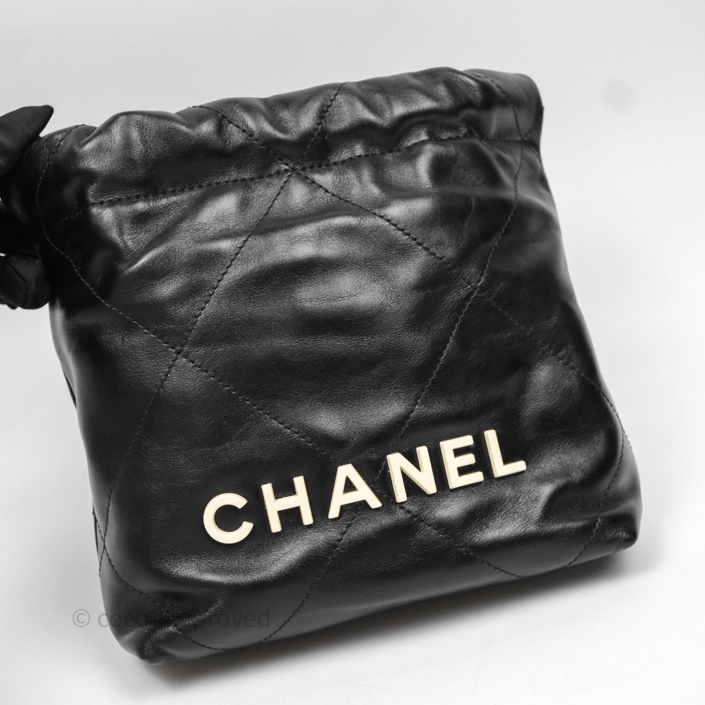 Chanel 22 Mini Bag Black Crumpled Calfskin White Lacquered Metal Logo