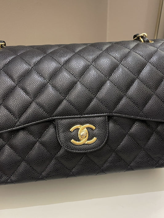 Luxury Chanel Classic Quilted Jumbo Double Flap Black Caviar