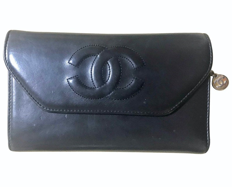 Luxury Chanel Vintage black leather wallet with large CC stitch mark
