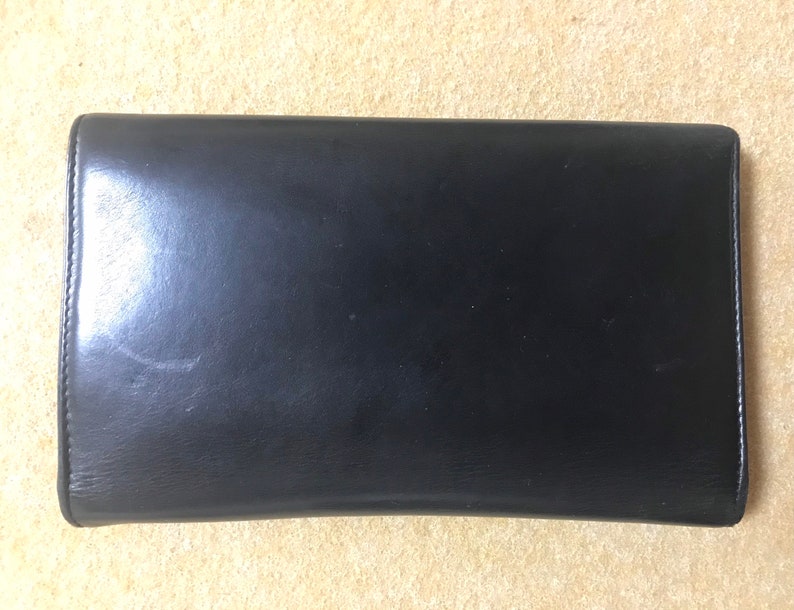 Luxury Chanel Vintage black leather wallet with large CC stitch mark