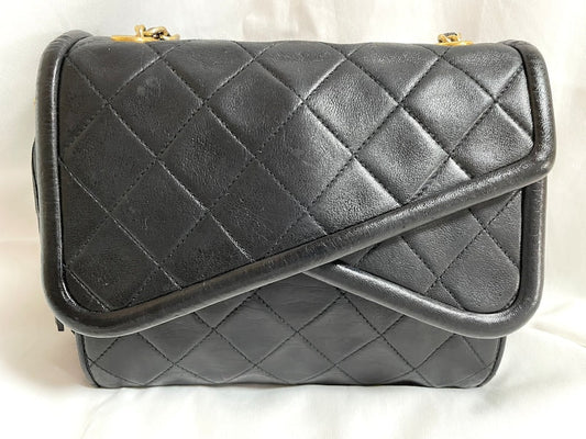 Luxury Chanel Vintage black fringe camera bag with double flaps