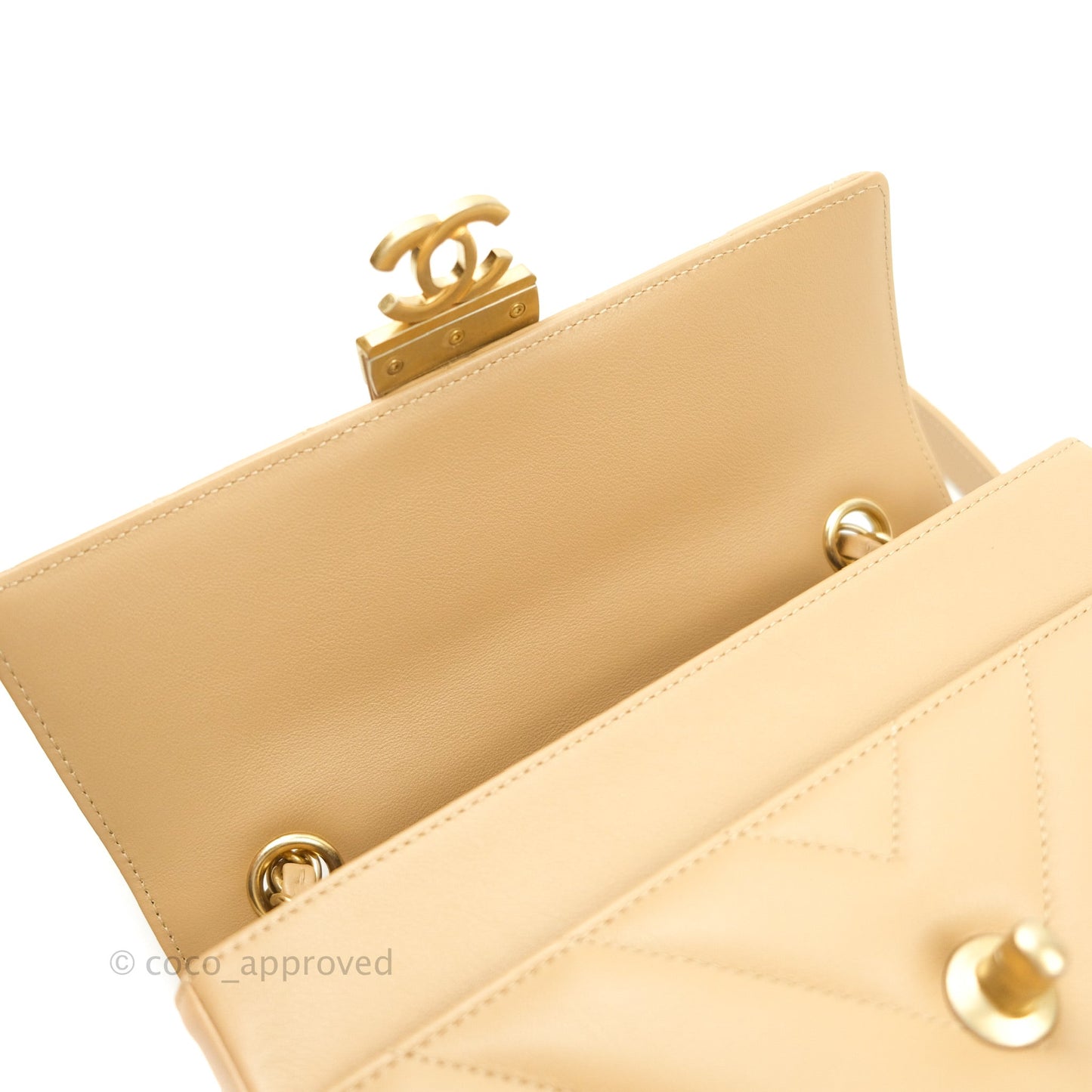 Chanel Quilted Chevron In The City Bag Beige Calfskin Aged Gold Hardware