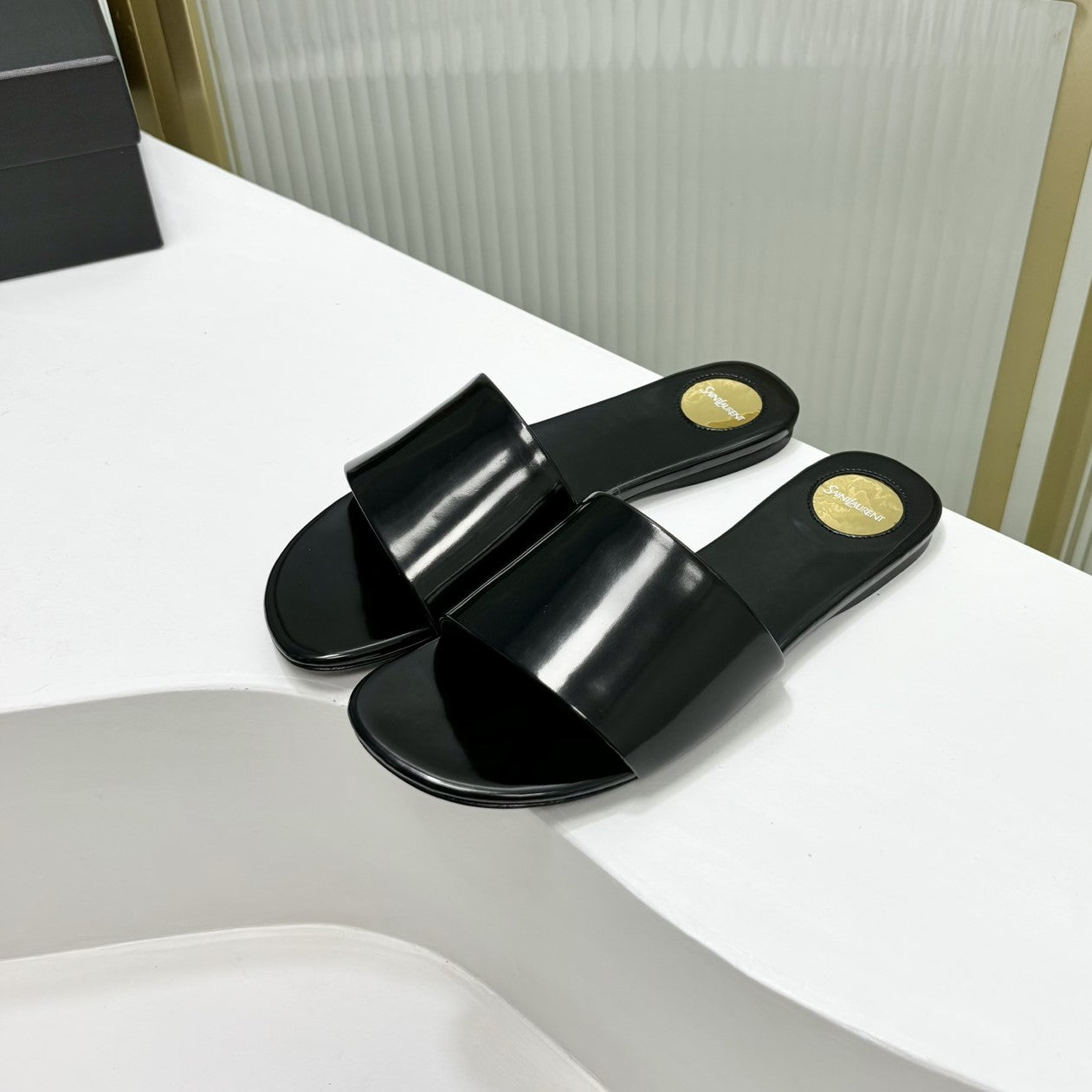 Luxury Saint Laurent CARLYLE SLIDES IN BLACK GLAZED LEATHER