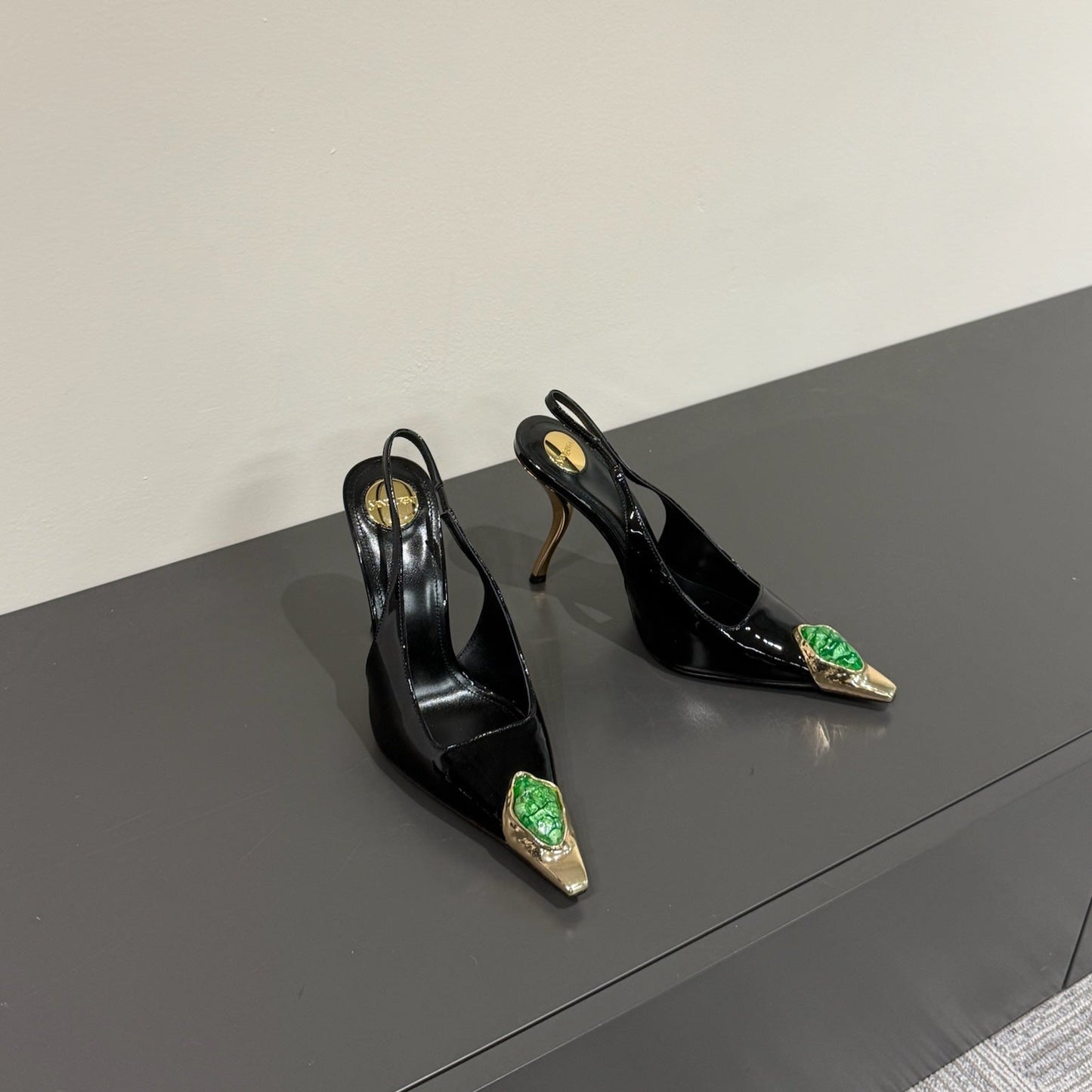 Luxury Saint Laurent GREEN GEM-STUDDED SLINGBACK PUMPS IN BLACK PATENT CALFSKIN