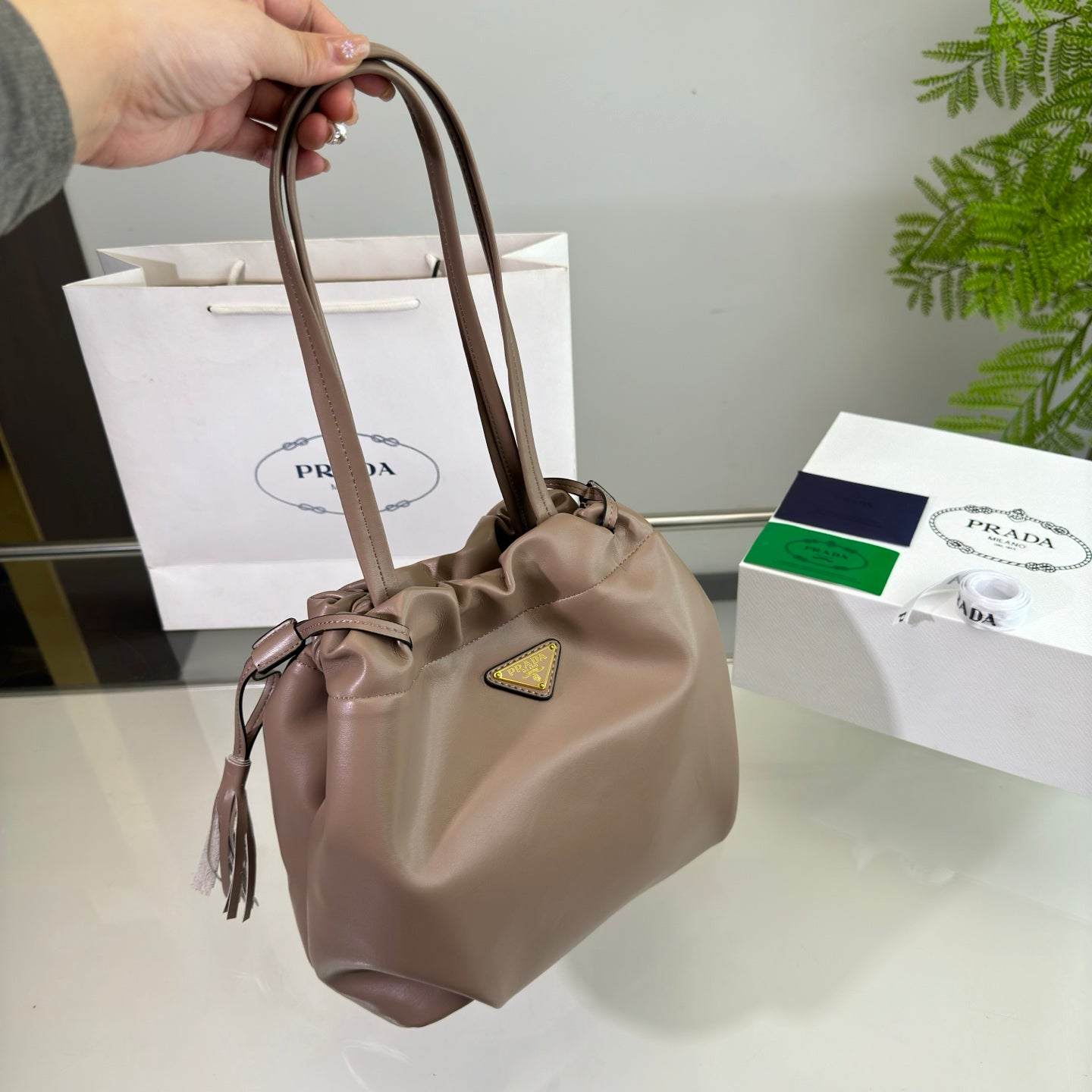 Luxury PradaDRAWSTRING BUCKET BAG 25 IN BROWN BEAR SOFT LAMBSKIN