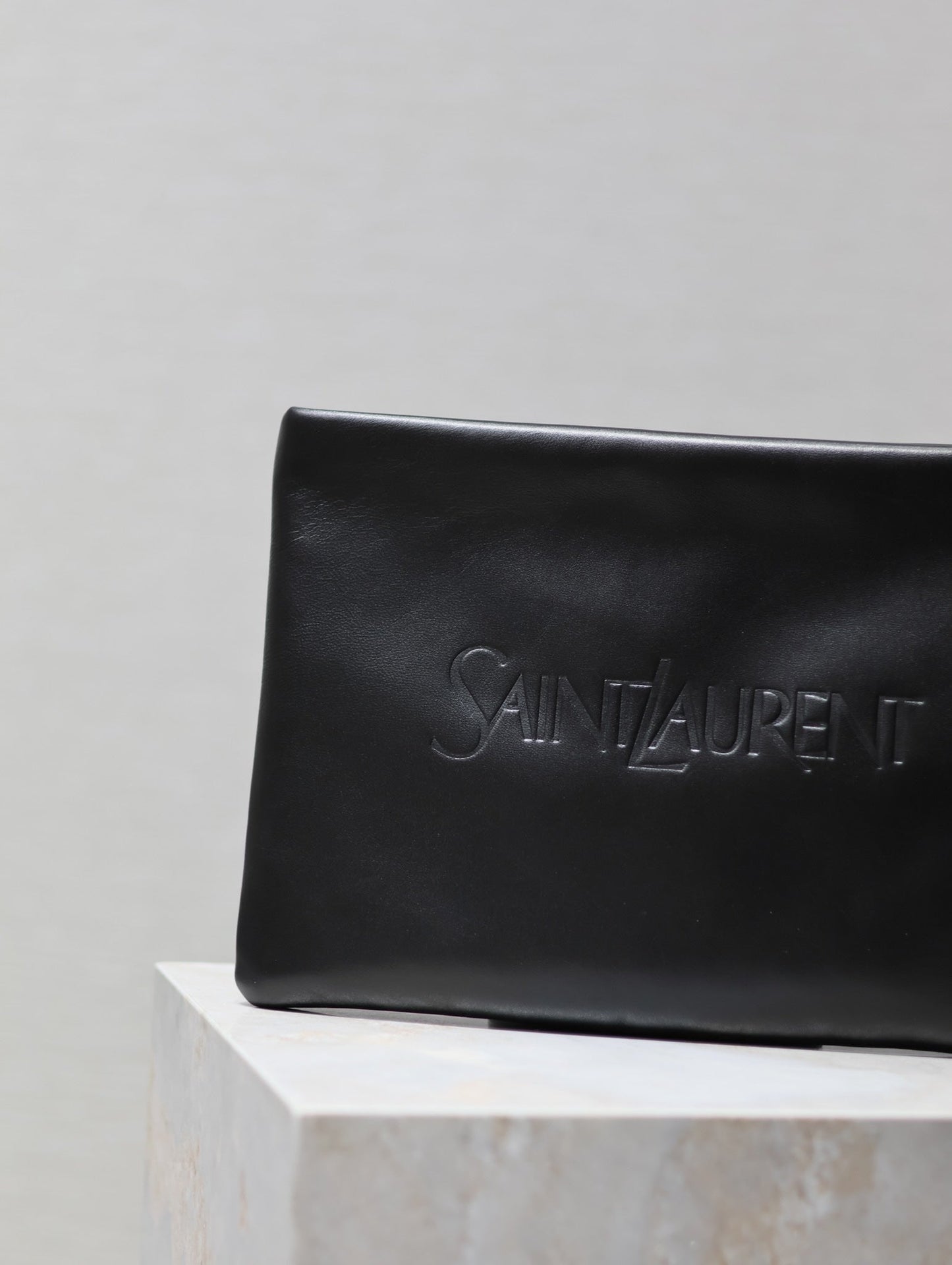 Luxury Saint Laurent POUCH 30 IN BLACK CALFSKIN WITH EMBOSSED LOGO