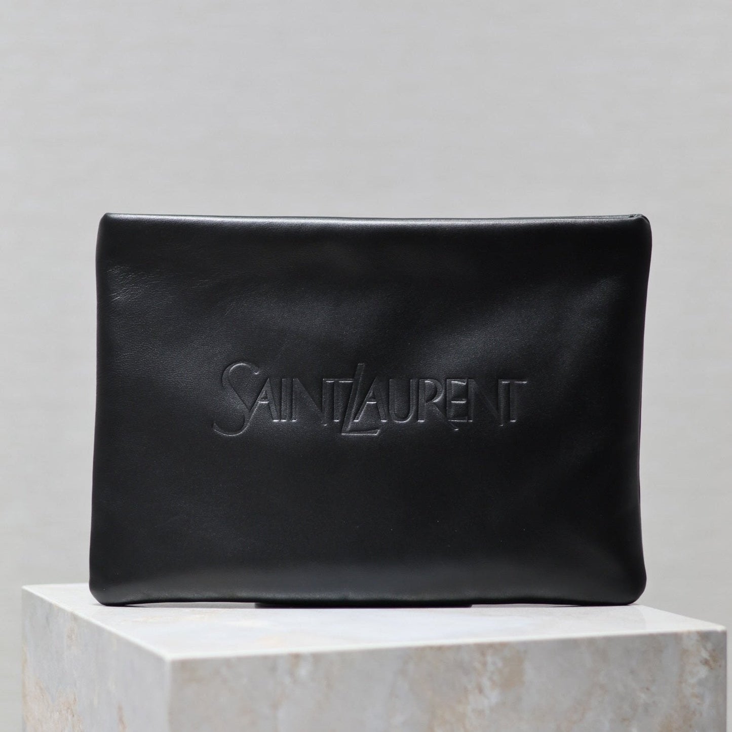 Luxury Saint Laurent POUCH 30 IN BLACK CALFSKIN WITH EMBOSSED LOGO