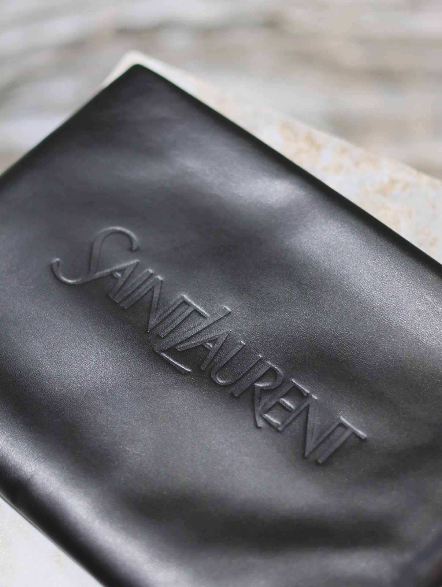 Luxury Saint Laurent POUCH 30 IN BLACK CALFSKIN WITH EMBOSSED LOGO