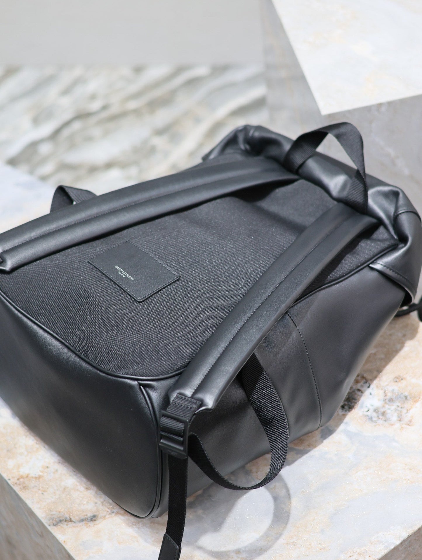 Luxury Saint Laurent BACKPACK 45 IN BLACK CALFSKIN WITH EMBOSSED LOGO