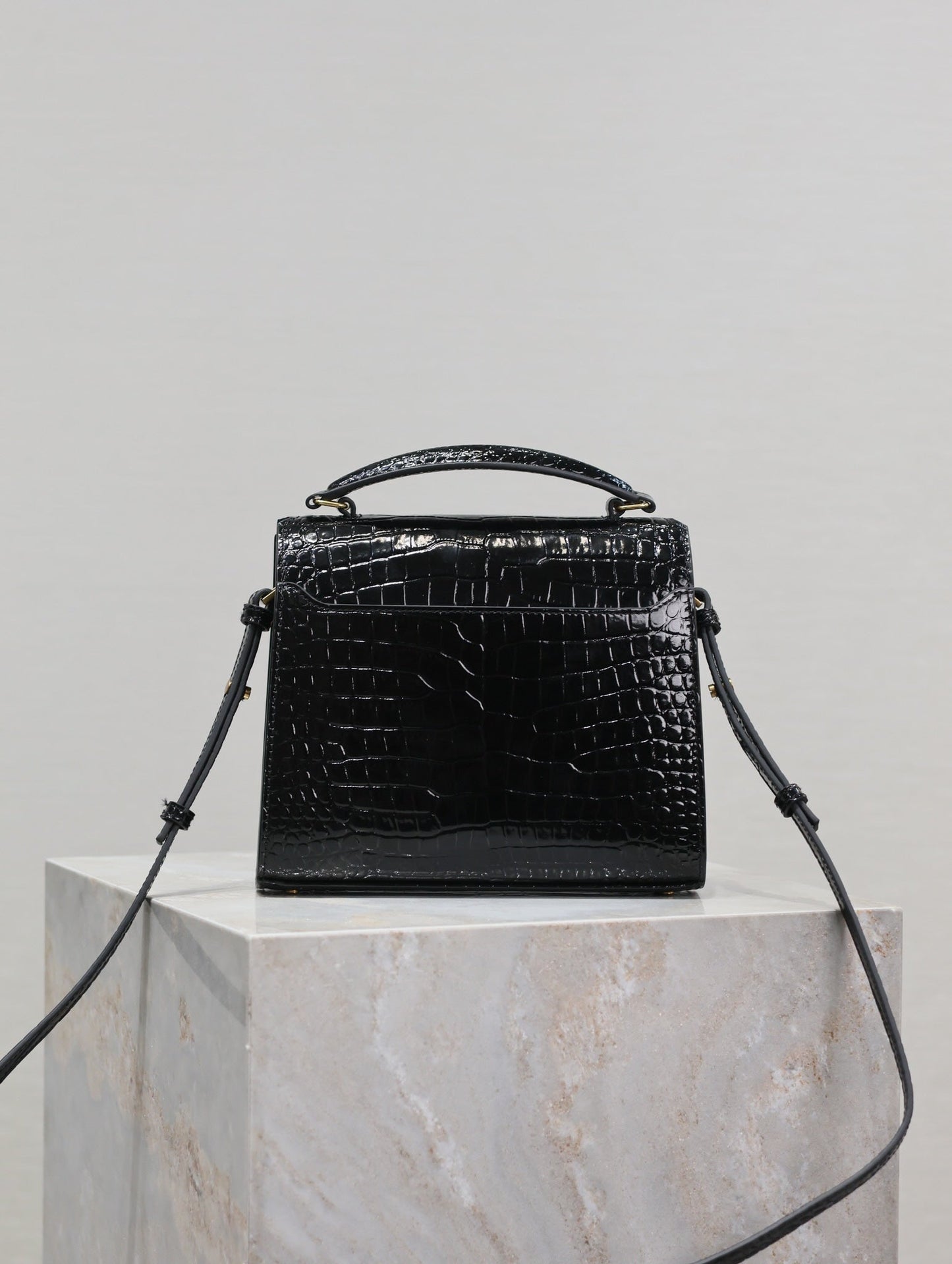 Luxury Saint Laurent CASSANDRA MINI TOP HANDLE BAG 20 IN BLACK CROCODILE-EMBOSSED GLOSSY CALFSKIN