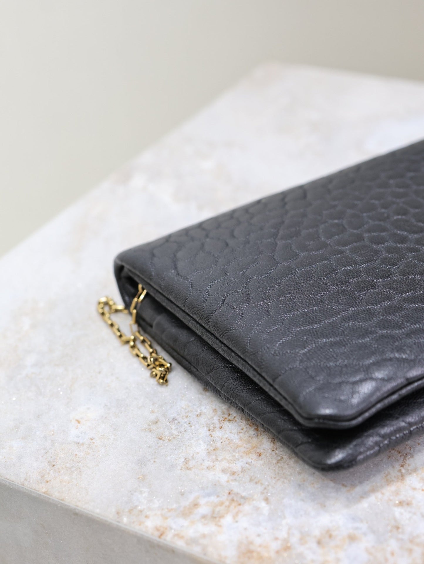 Luxury Saint Laurent CALYPSO POUCH 24 IN BLACK ELEPHANT TEXTURED LAMBSKIN GOLD LOGO